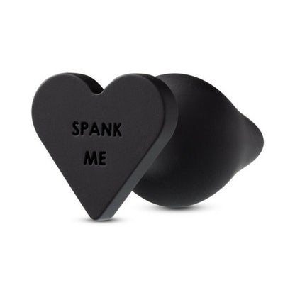 TEMPTASIA ''SPANK ME'' SILICONE ANAL PLUG WITH HEART-SHAPED BASE BLACK