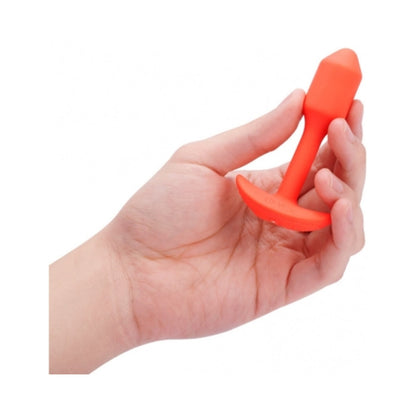 B-VIBE - VIBRATING SNUG PLUG 1 RECHARGEABLE WEIGHTED SILICONE ANAL PLUG ORANGE