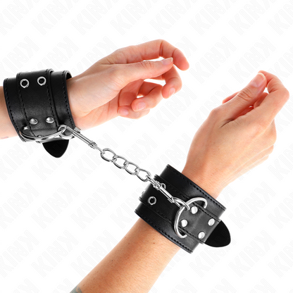 KINK - MUÑEQUERAS DE SUJECIÓN CON DOBLE HEBILLA NEGRAS AJUSTABLES 19-26 CM