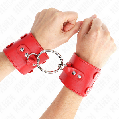 KINK - MENOTTES RIGIDES AVEC ANNEAU ET CLOUS, RÉGLABLES ROUGES 17-22 CM X 6,5 CM