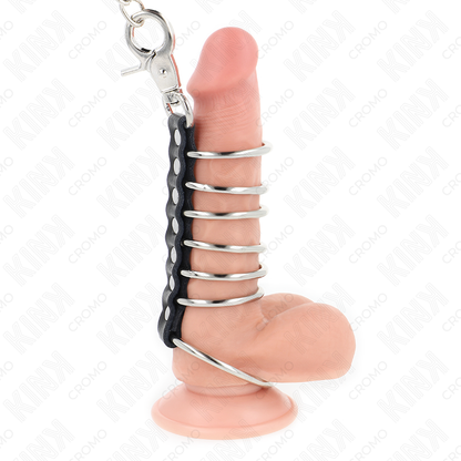 KINK - 7 ANNEAUX DE PÉNIS EN MÉTAL DE 3,8 CM À 5 CM RELIÉS PAR DU CUIR ET UNE CHAÎNE EN MÉTAL DE 100 CM