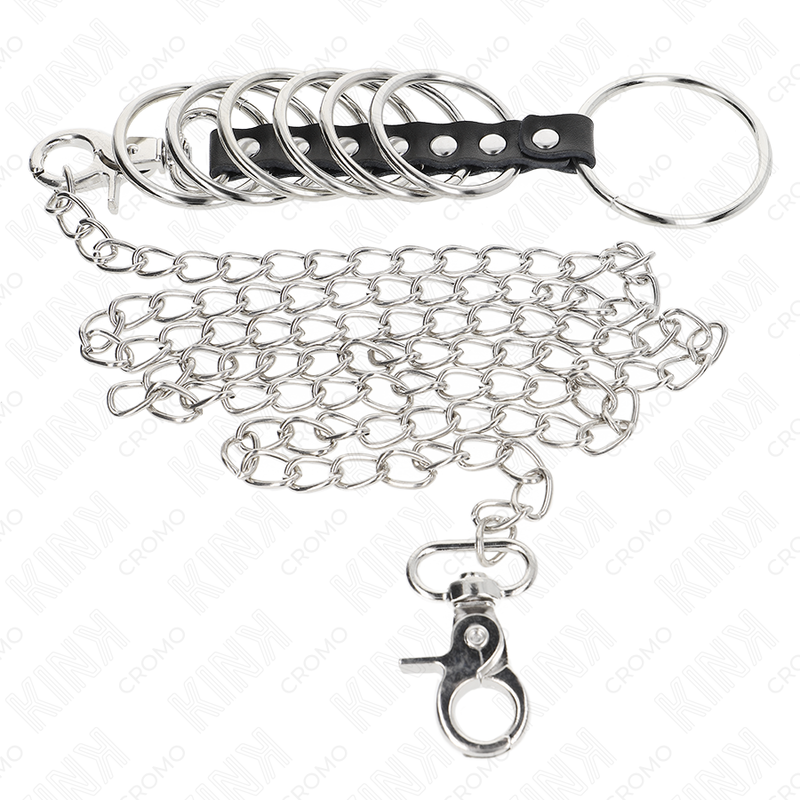 KINK - 7 ANNEAUX DE PÉNIS EN MÉTAL DE 3,8 CM À 5 CM RELIÉS PAR DU CUIR ET UNE CHAÎNE EN MÉTAL DE 100 CM
